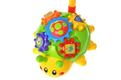 Каталка A0392 "Жук" з ручкою, 2 кольори, в кульку р.20x12x23 см YG Toys купити